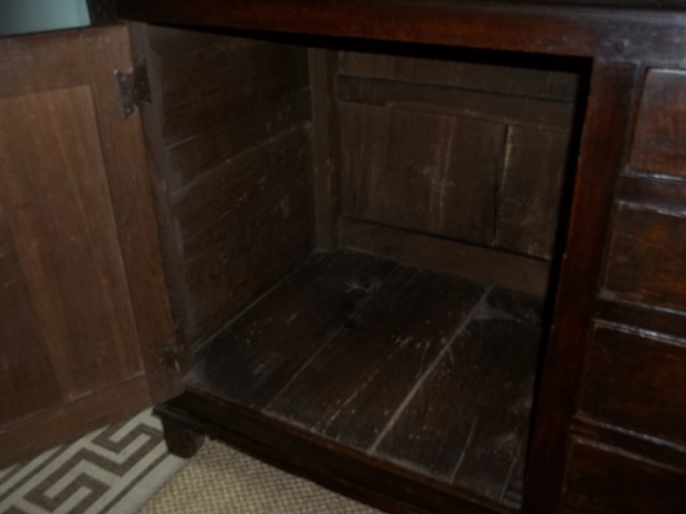 A Welsh Geo II early 18th century Georgian oak dresser base with spice drawers serving table sdieboard.  View VIII