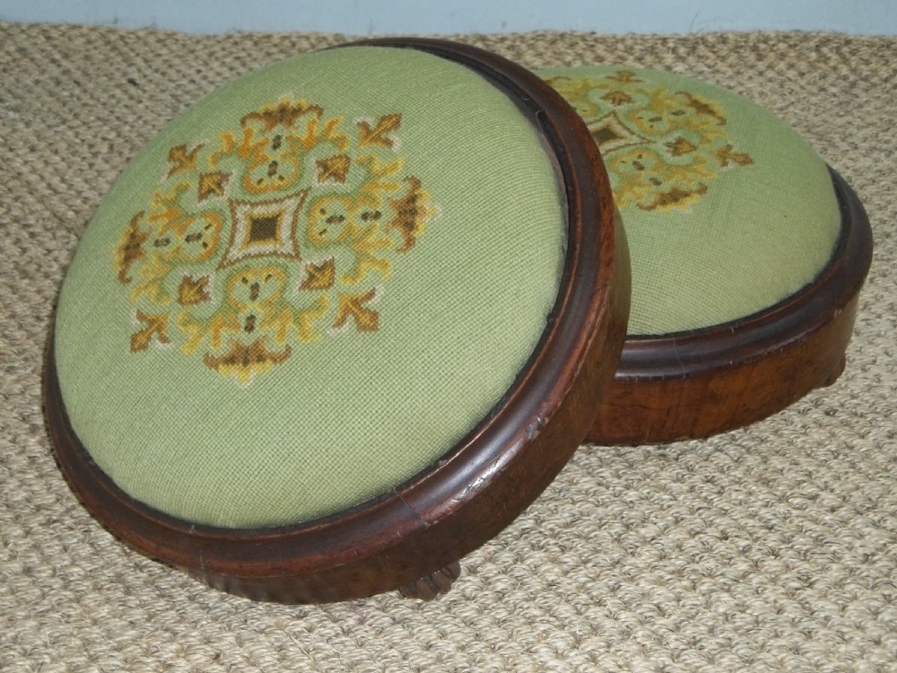 Antique pair of walnut petit point tapestry upholstered circular small gout footstools foot stools