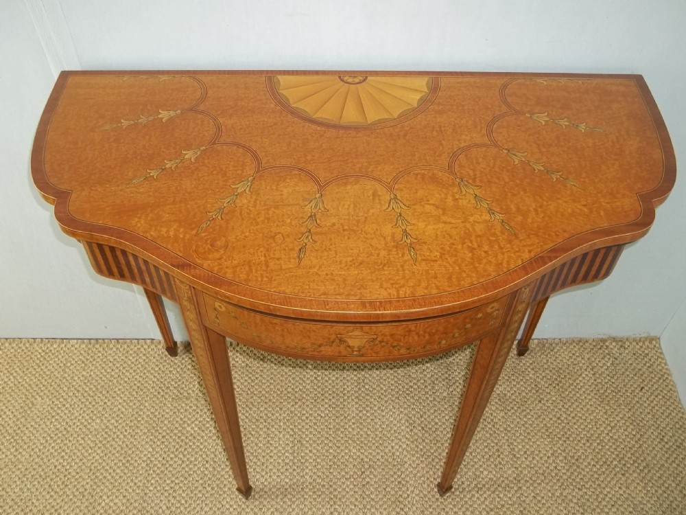 A stunning Sheraton Regency design  serpentine fronted marquetry inlaid satinwood card games side hall lamp occasional table. C.1895