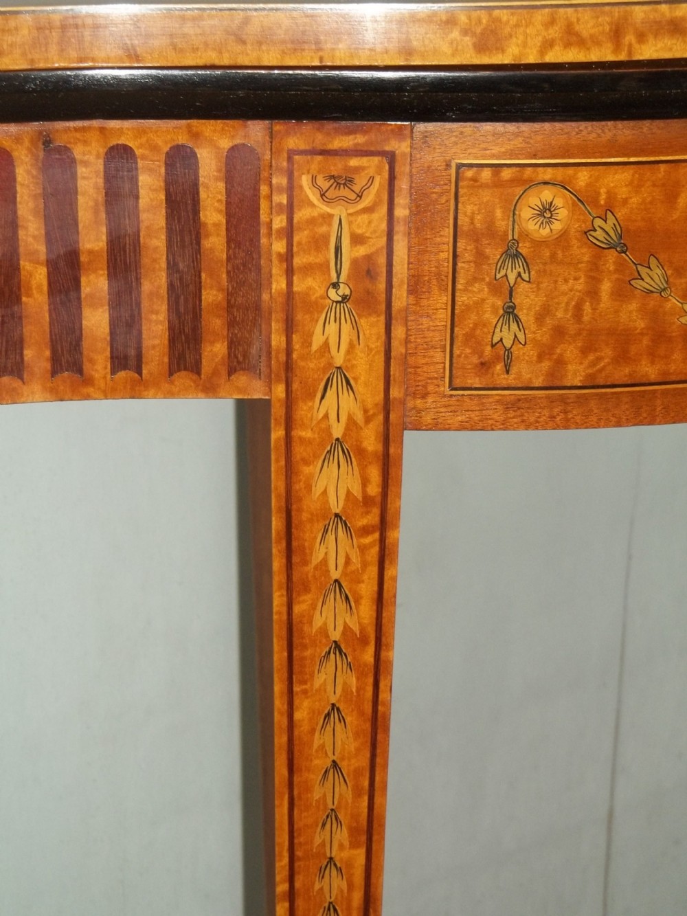 A stunning Sheraton Regency design  serpentine fronted marquetry inlaid satinwood card games side hall lamp occasional table. C.1895 View VI