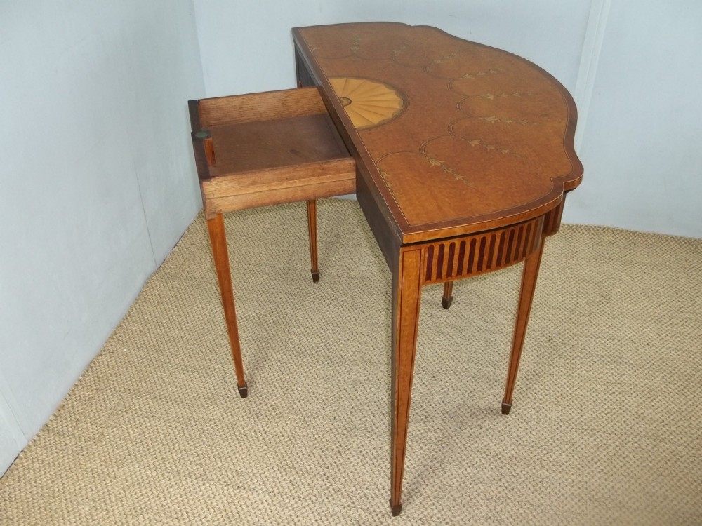 A stunning Sheraton Regency design  serpentine fronted marquetry inlaid satinwood card games side hall lamp occasional table. C.1895 View X