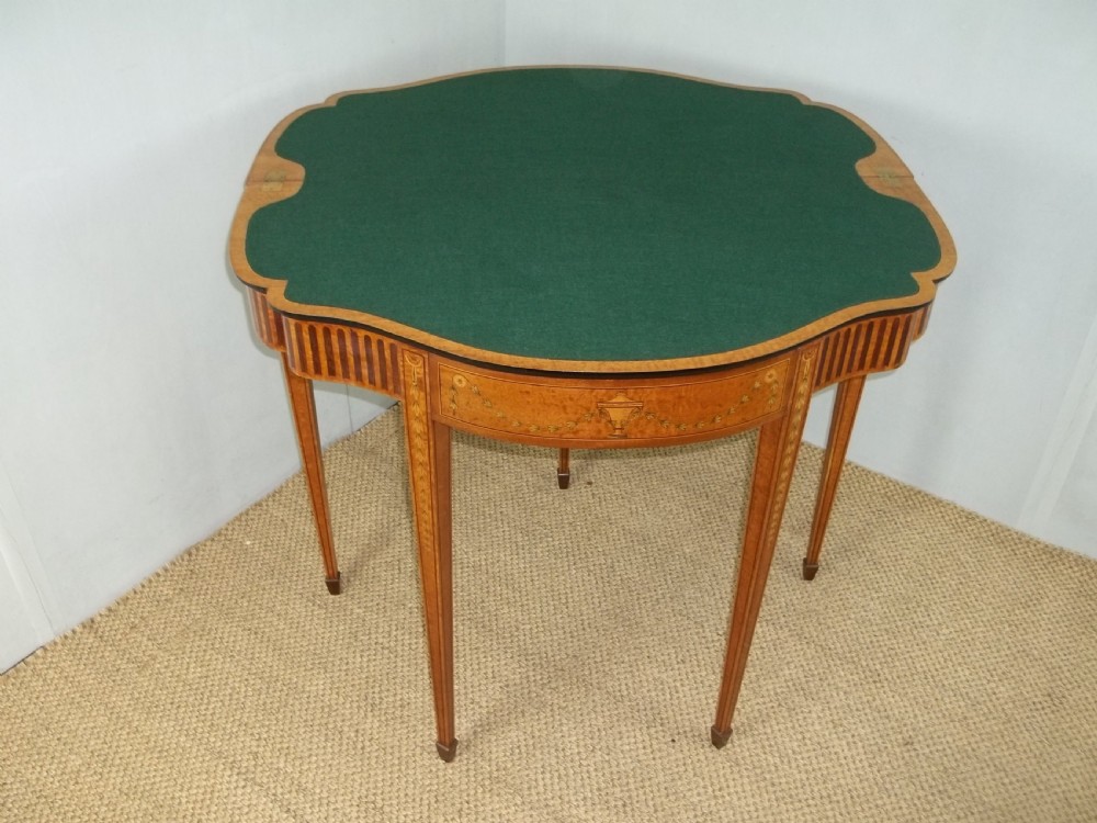 A stunning Sheraton Regency design  serpentine fronted marquetry inlaid satinwood card games side hall lamp occasional table. C.1895 View XII