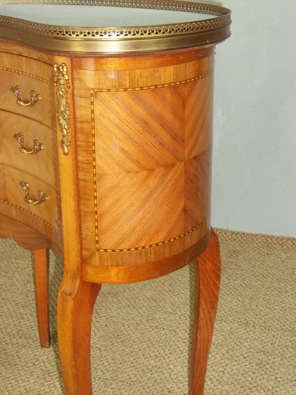 A pair of antique walnut French  inlaid bedside lamp chests with flat marble table top and gilt bronze ormolu mounts View V