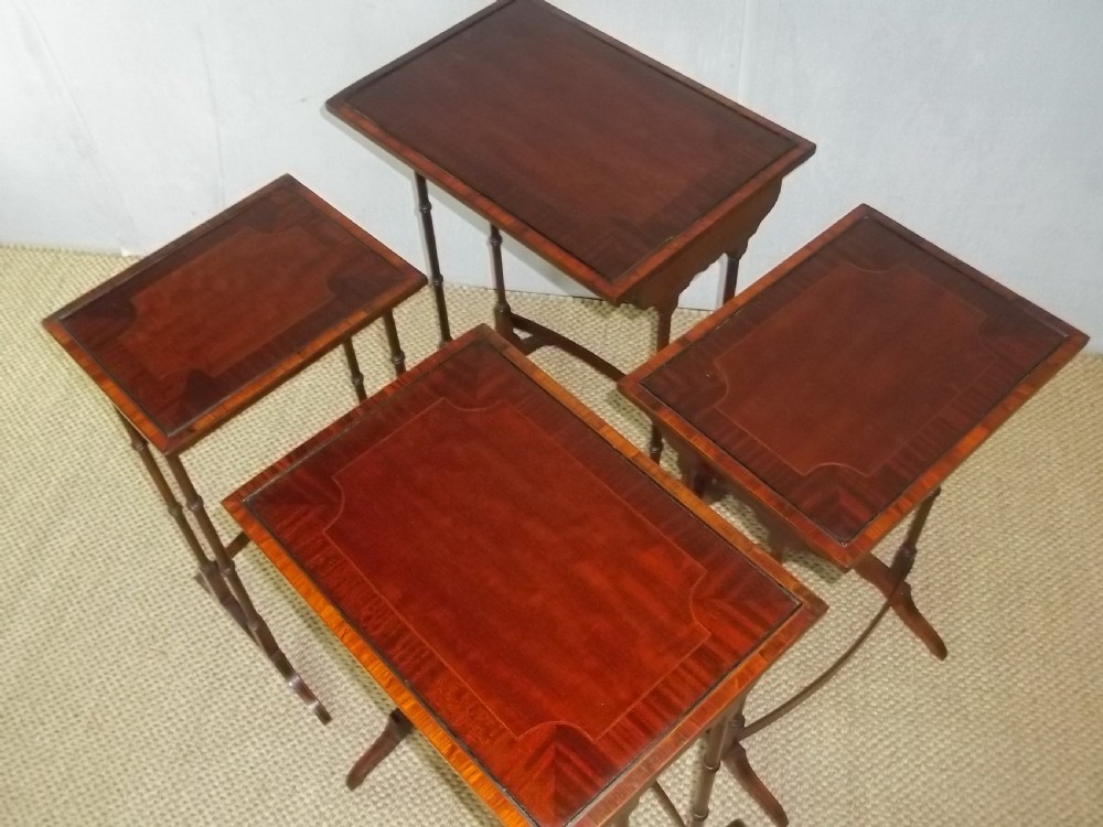 A late 19th/early 20th century set of mahogany inlaid quartetto nest of four stacking coffee side wine sofa tables  View II