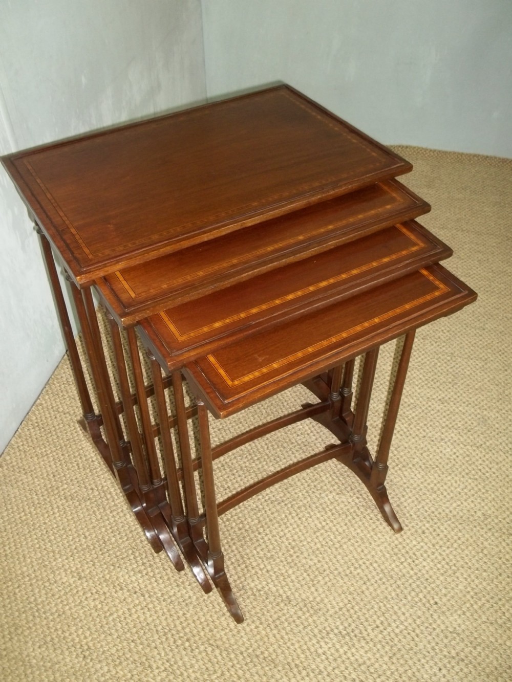 Antique quartetto nest of four mahogany and satinwood inlaid coffee side wine sofa stacking tables