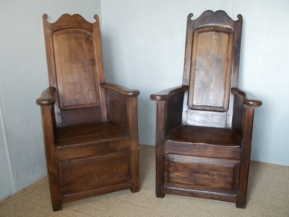 Extremely rare matched pair of Welsh elm 18th/19th century lambing wainscot hall reading panelled primitive joint fireside arm elbow oak alder chairs armchairs thrones. 