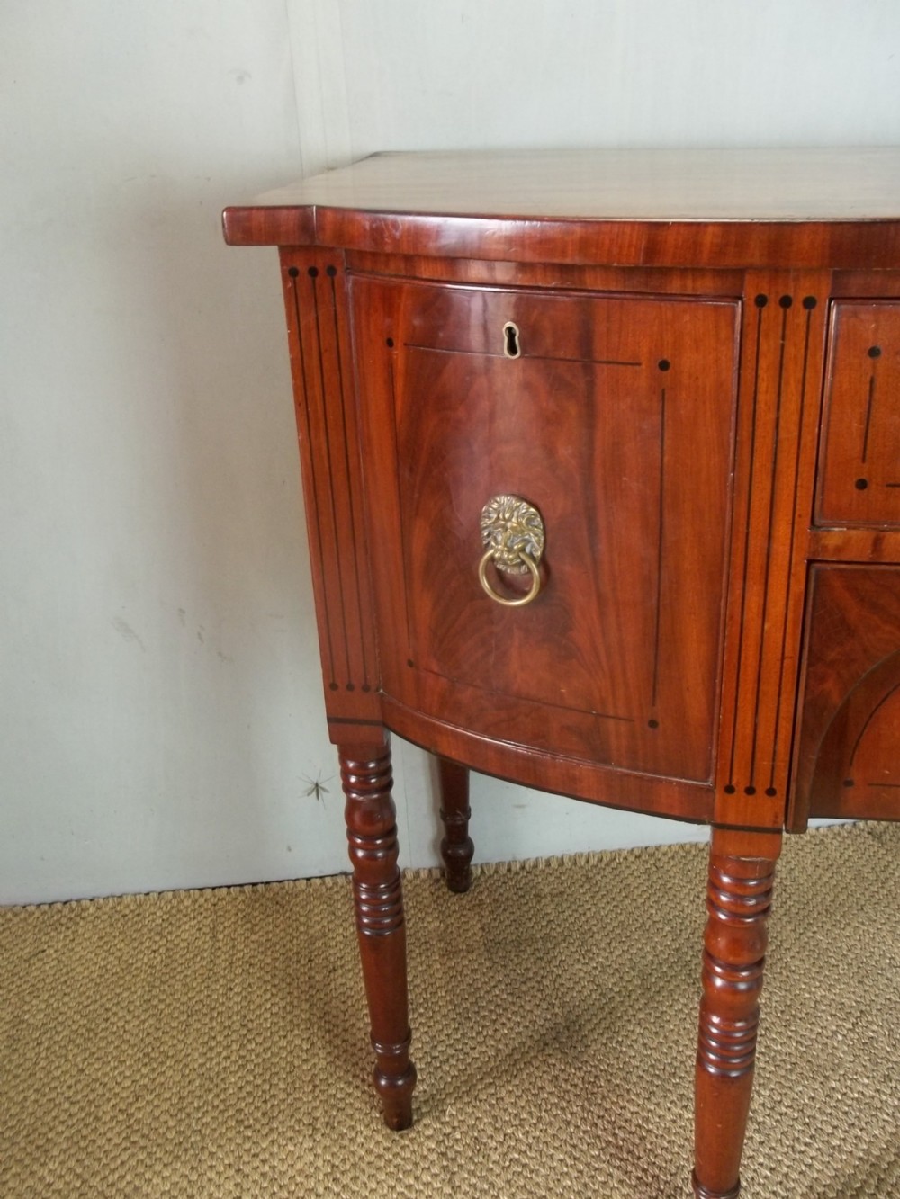 Superb quality Georgian small Regency mahogany bowfront inlaid sideboard serving table of bow break front in the manner of George Oakley. C1810. View V