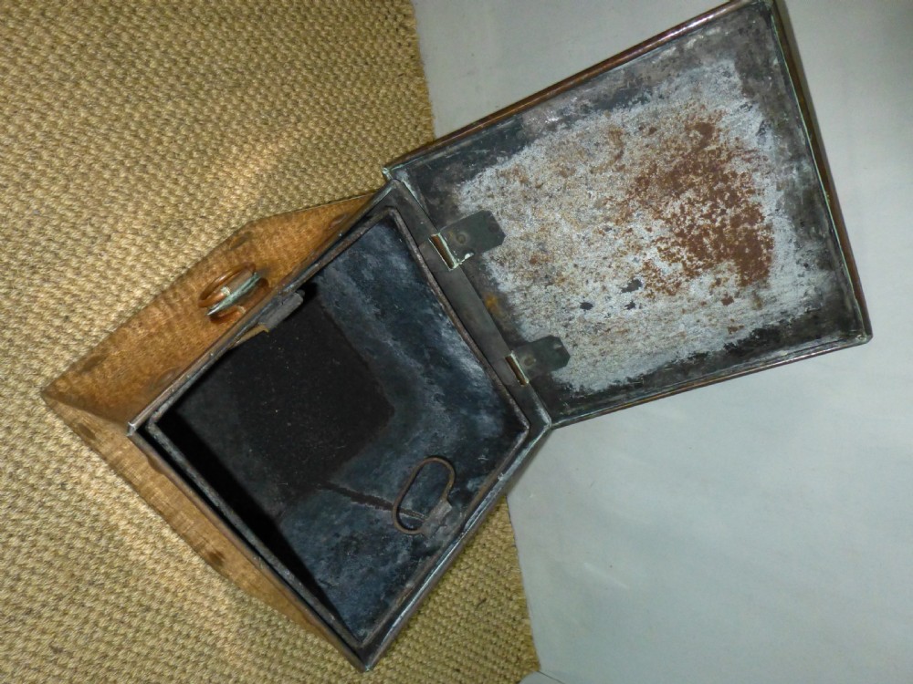 An Arts and Crafts copper square coal purdonium box featuring a planished surface, corner rivets, and drop ring handles. View V