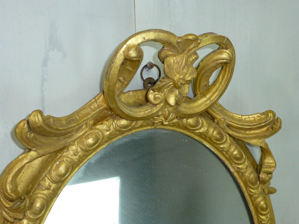 Antique 19th century English gilt girandole oval wall  looking glass mirror. C1860 View III