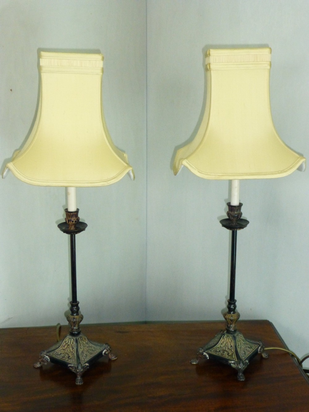 A pair of early 20th century bronzed table lamps
