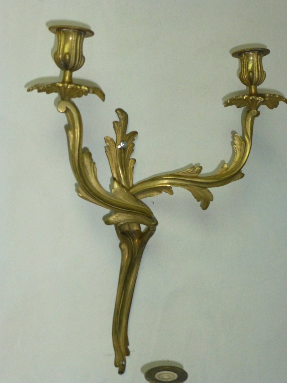 A pair of rococo gilt brass wall light sconces. View III