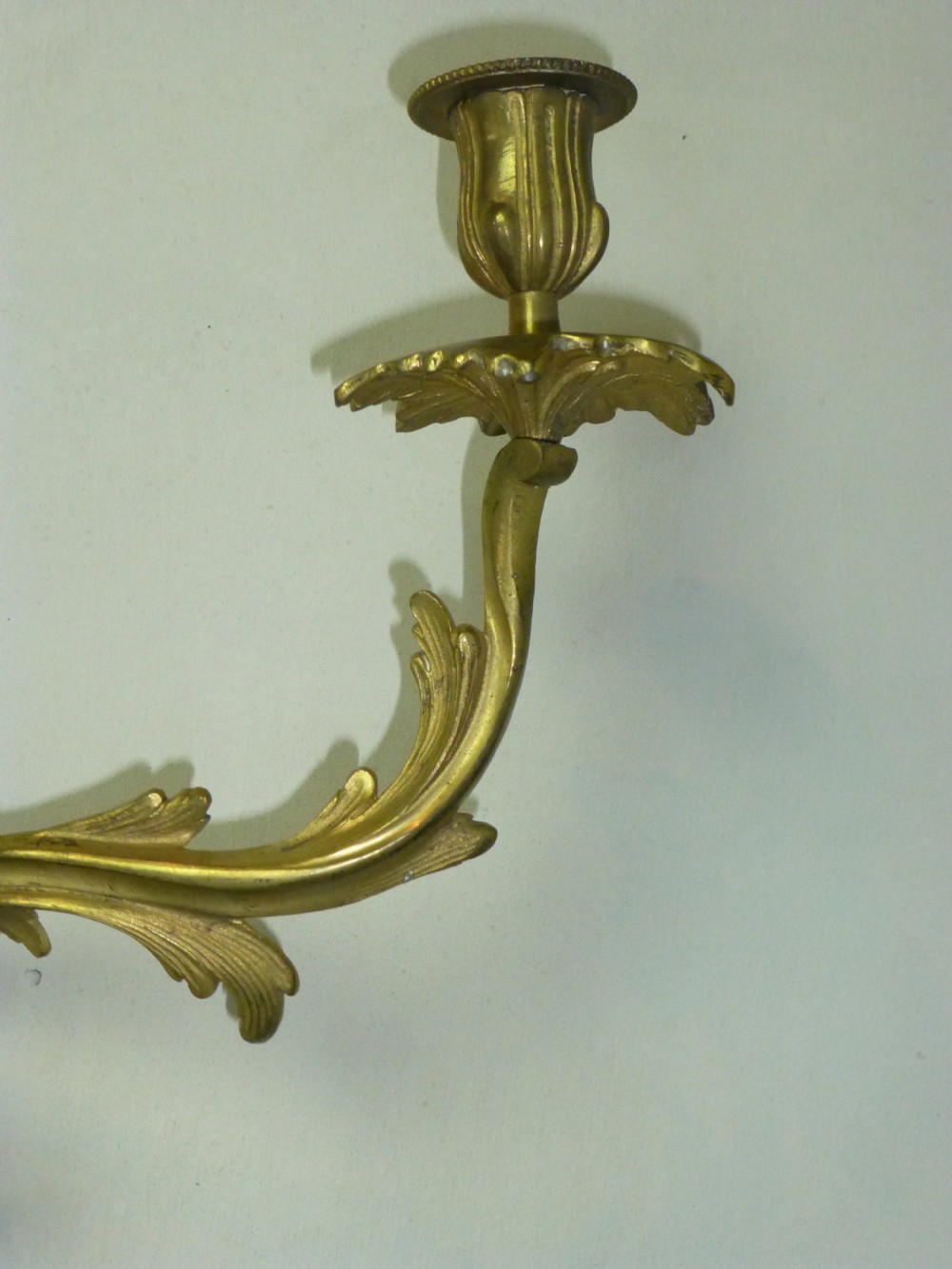 A pair of rococo gilt brass wall light sconces. View IV