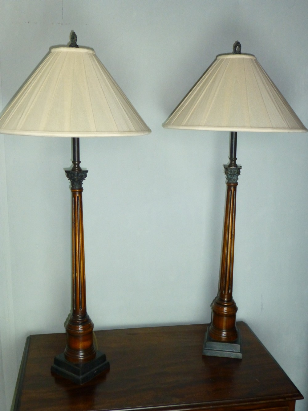 A fabulous pair of large bronze and walnut table lamps. C1920