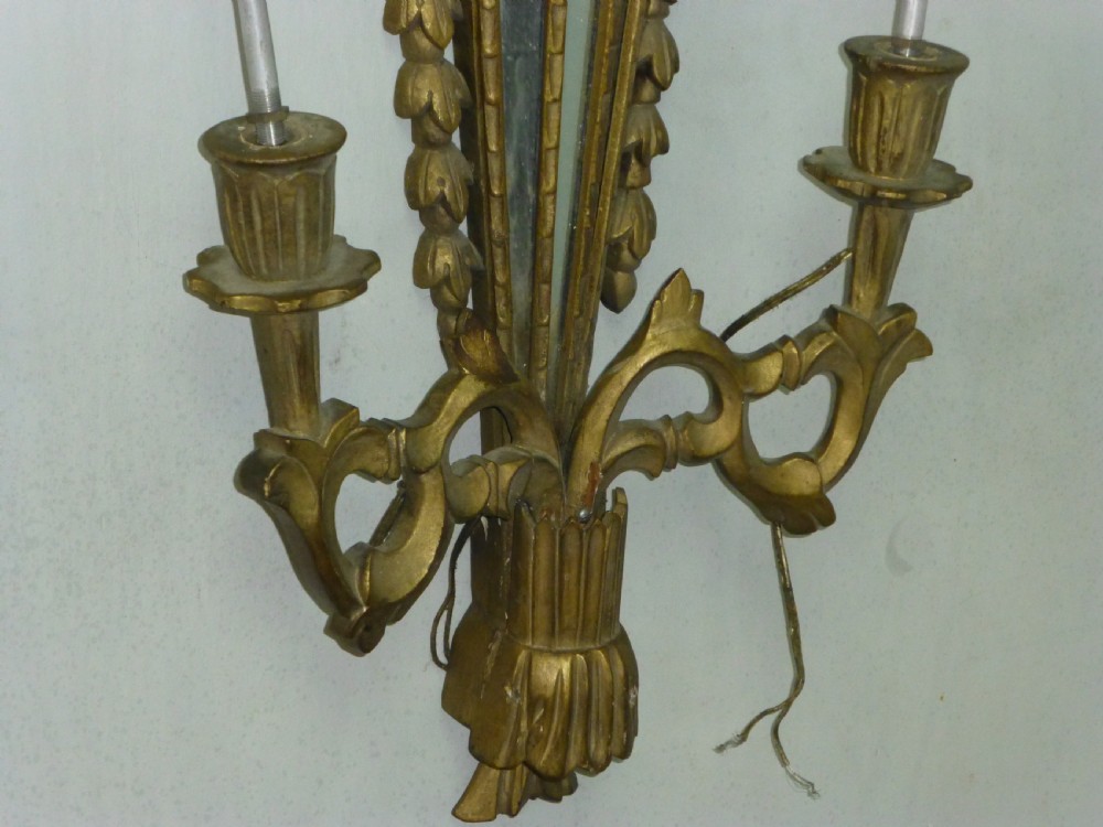 a large carved giltwood wall light sconce. C1920. View II