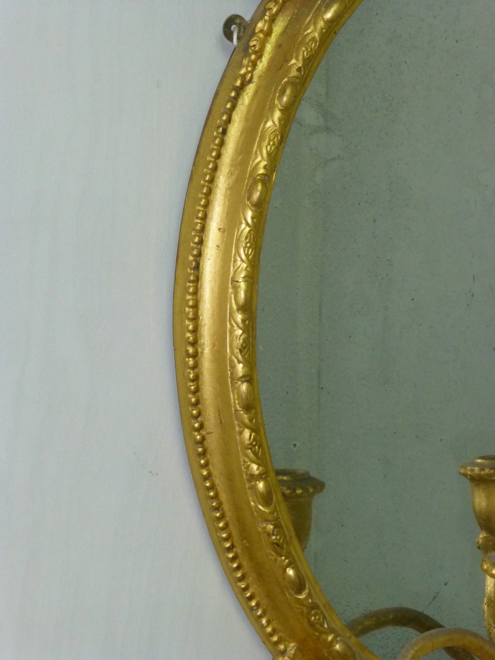 A good quality gilt gilded 19th century girandole oval mirror. C1860. View IV