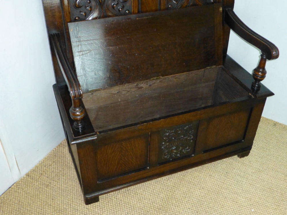 A stunning quality small Art Nouveau oak box settle hall bench. C 1890. View IV