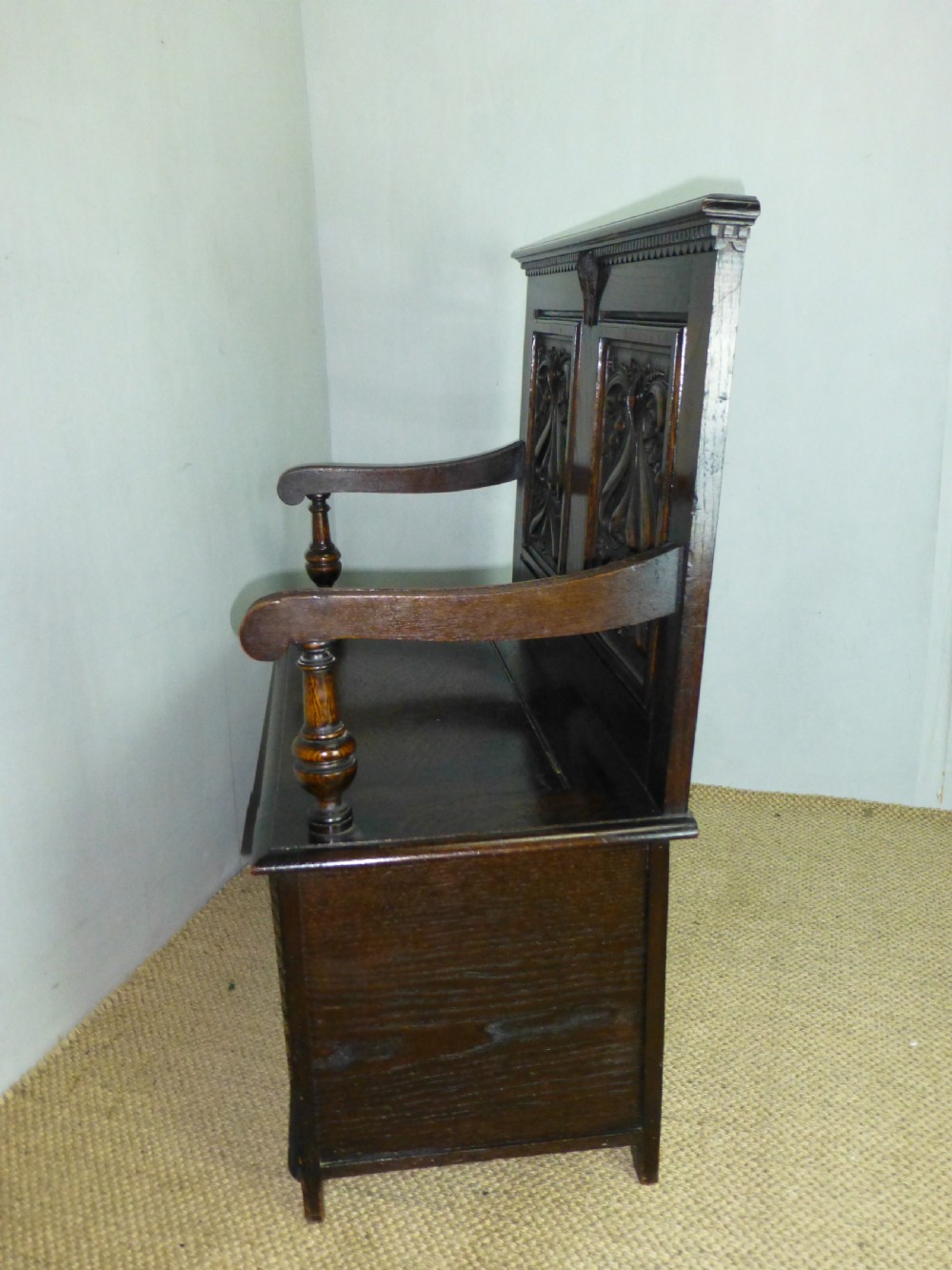 A stunning quality small Art Nouveau oak box settle hall bench. C 1890. View V