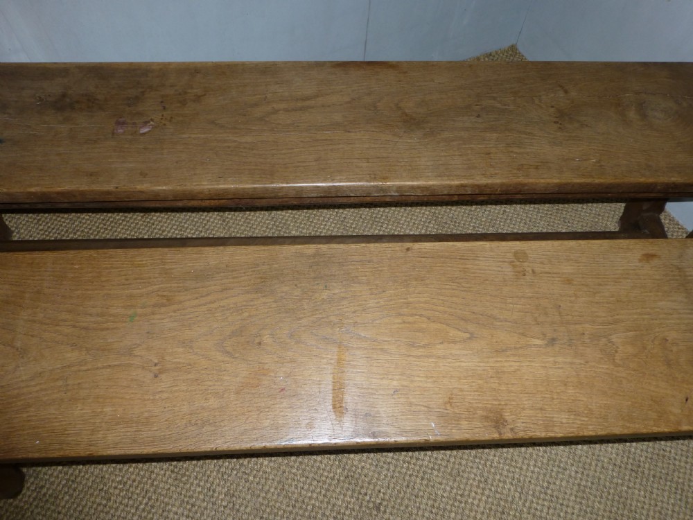 Fabulous pair of trestle design 19th century oak benches. Circa 1870. View VII