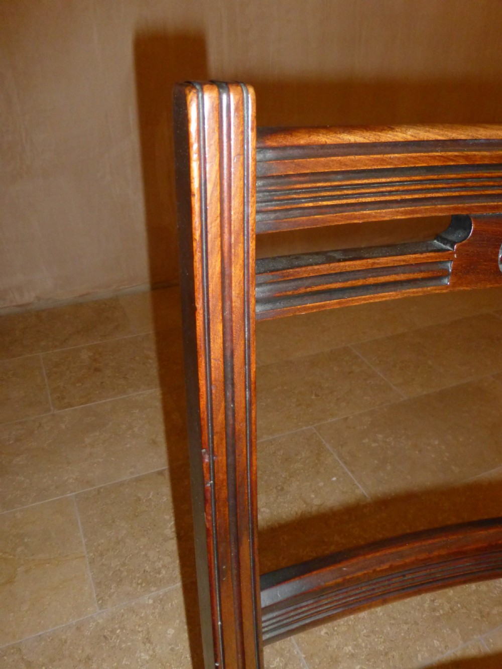 A set of ten 19th-century Victorian dark mahogany dining chairs featuring carved back rails, turned front legs, and yellow patterned fabric upholstered seats. View III