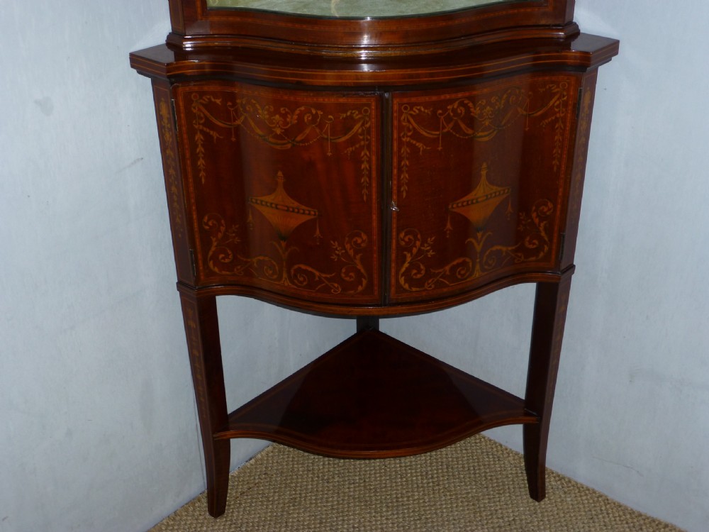 Superior Edwards and Roberts mahogany marquetry inlaid serpentine shaped  fronted standing double height corner cupboard cabinet. C1900. View II