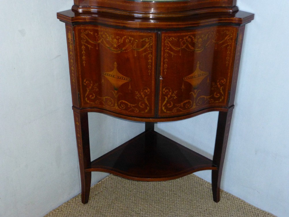 Superior Edwards and Roberts mahogany marquetry inlaid serpentine shaped  fronted standing double height corner cupboard cabinet. C1900. View IV
