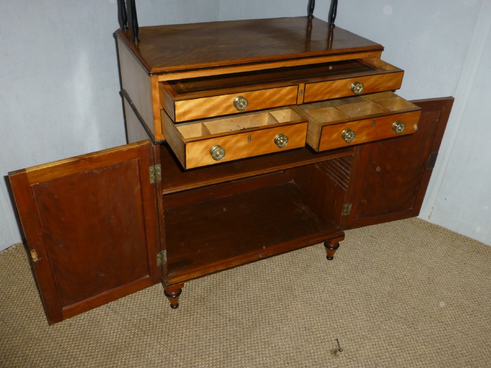 A Regency satinwood chiffonnier desk featuring two tiered upper shelves with ebonised turned supports above drawers and a double cupboard door cabinet. View VIII