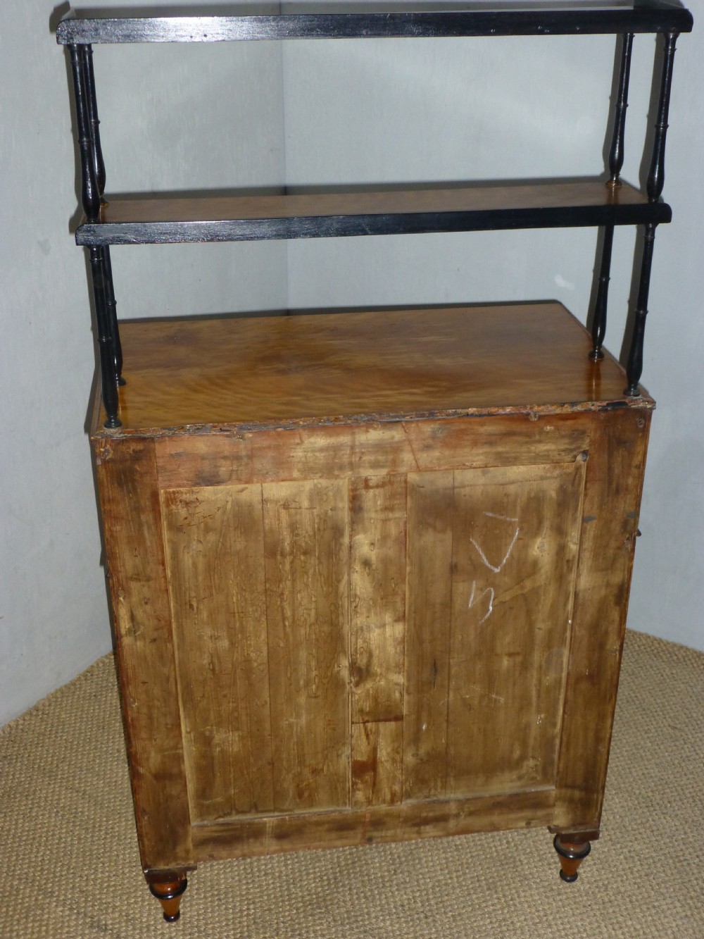 A Regency satinwood chiffonnier desk featuring two tiered upper shelves with ebonised turned supports above drawers and a double cupboard door cabinet. View XI