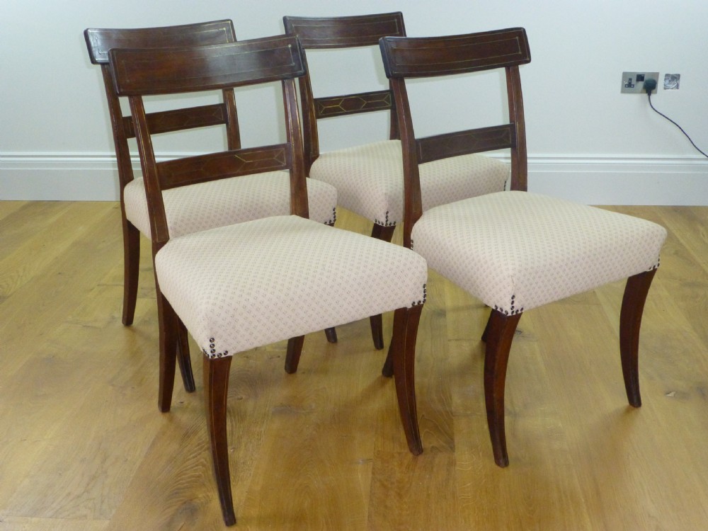 A good quality set of four mahogany  Regency brass inlaid dining chairs. C1810
