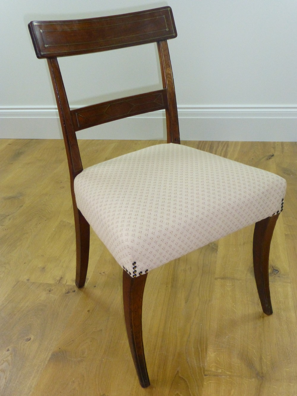 A good quality set of four mahogany  Regency brass inlaid dining chairs. C1810 View II