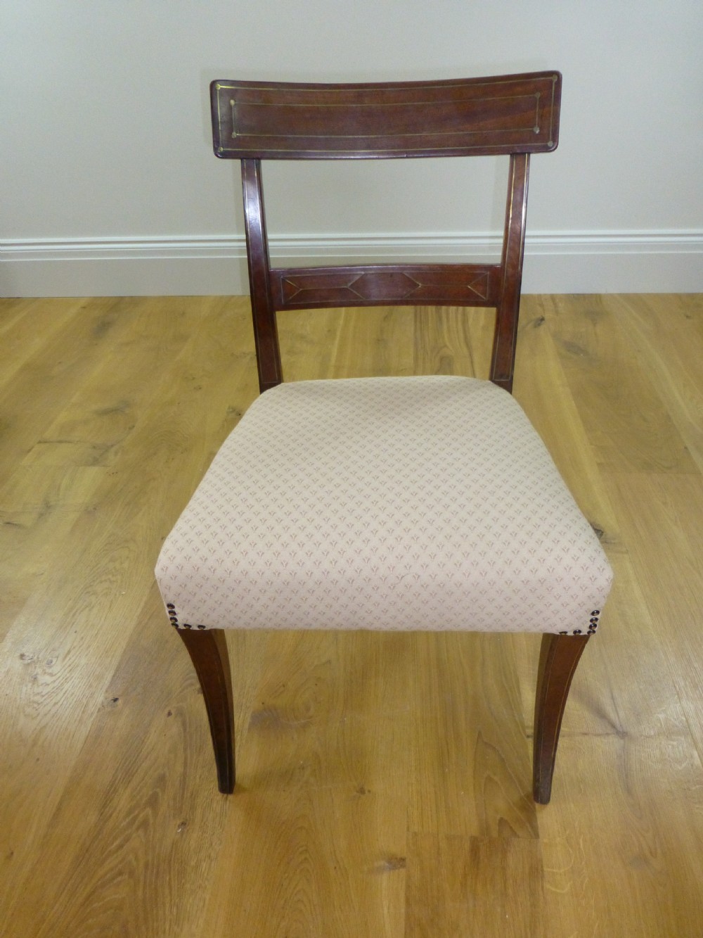 A good quality set of four mahogany  Regency brass inlaid dining chairs. C1810 View III