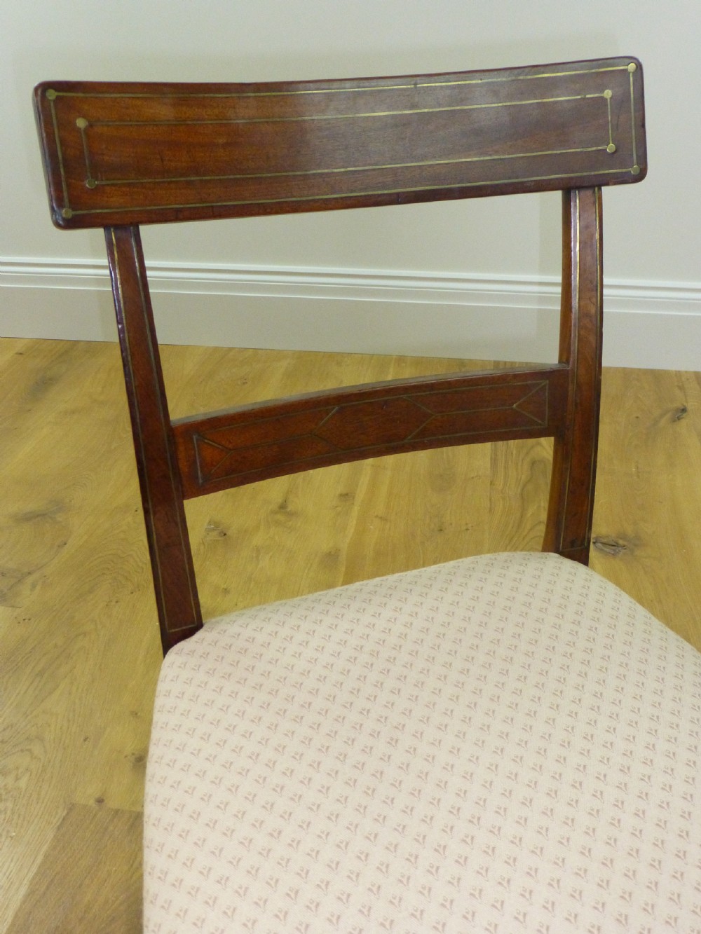 A good quality set of four mahogany  Regency brass inlaid dining chairs. C1810 View IV