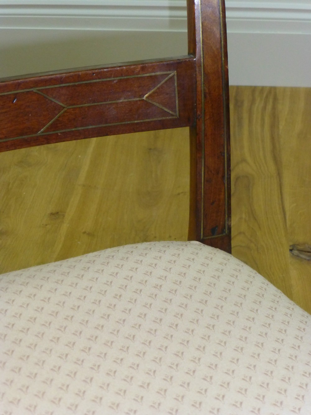 A good quality set of four mahogany  Regency brass inlaid dining chairs. C1810 View V
