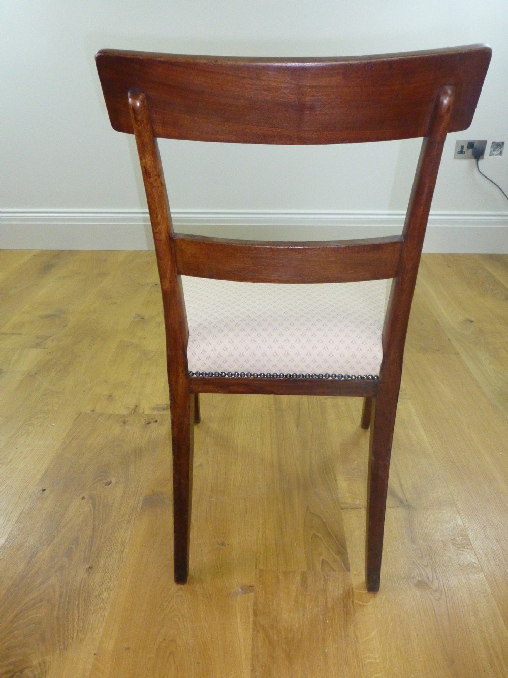 A good quality set of four mahogany  Regency brass inlaid dining chairs. C1810 View X