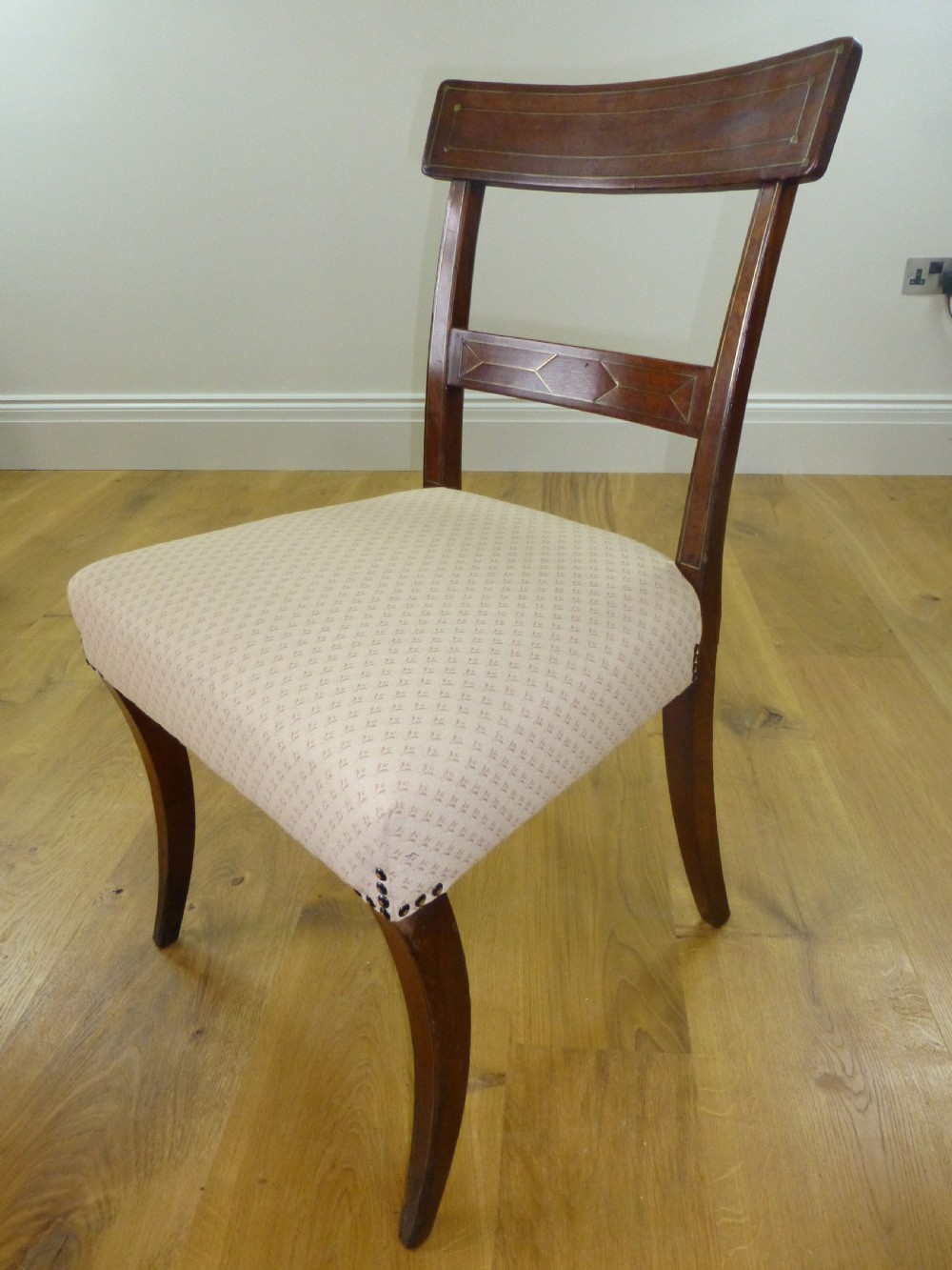A good quality set of four mahogany  Regency brass inlaid dining chairs. C1810 View XI