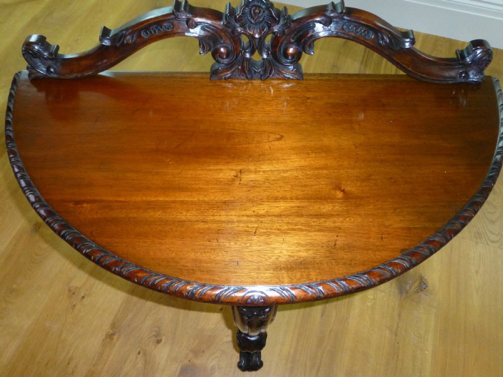 A great quality carved small mahogany demi lune  half moon hall console pier side lamp semi circular table. C1860 View III