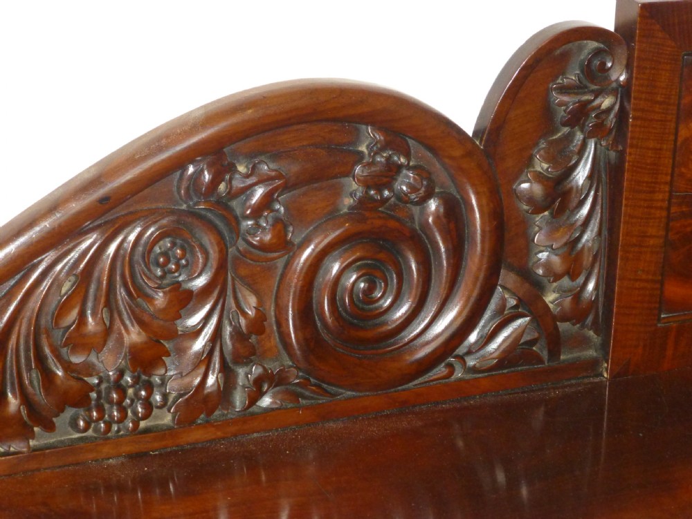 A dark mahogany Regency serving table featuring a scroll-carved backboard, a smooth top surface, and carved scroll front legs. View VII