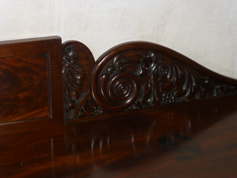 A dark mahogany Regency serving table featuring a scroll-carved backboard, a smooth top surface, and carved scroll front legs. View VIII