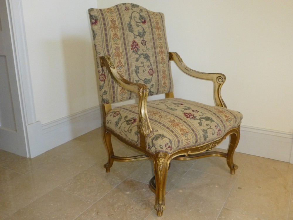A pair of 19th-century giltwood Gainsborough salon armchairs with floral pattern upholstery and cabriole legs. View III