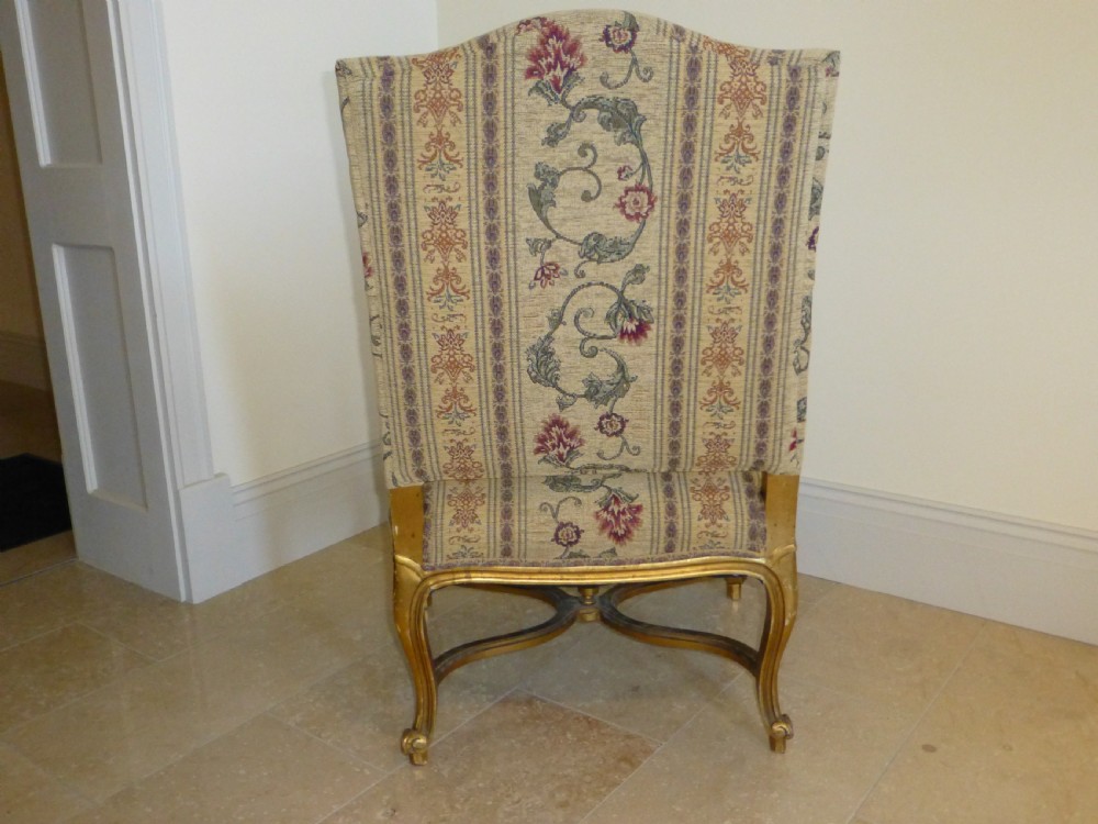 A pair of 19th-century giltwood Gainsborough salon armchairs with floral pattern upholstery and cabriole legs. View VI