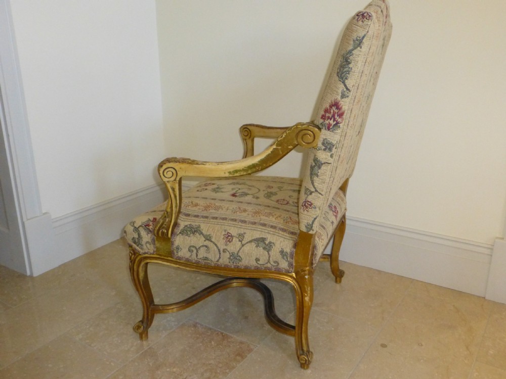 A pair of 19th-century giltwood Gainsborough salon armchairs with floral pattern upholstery and cabriole legs. View VII