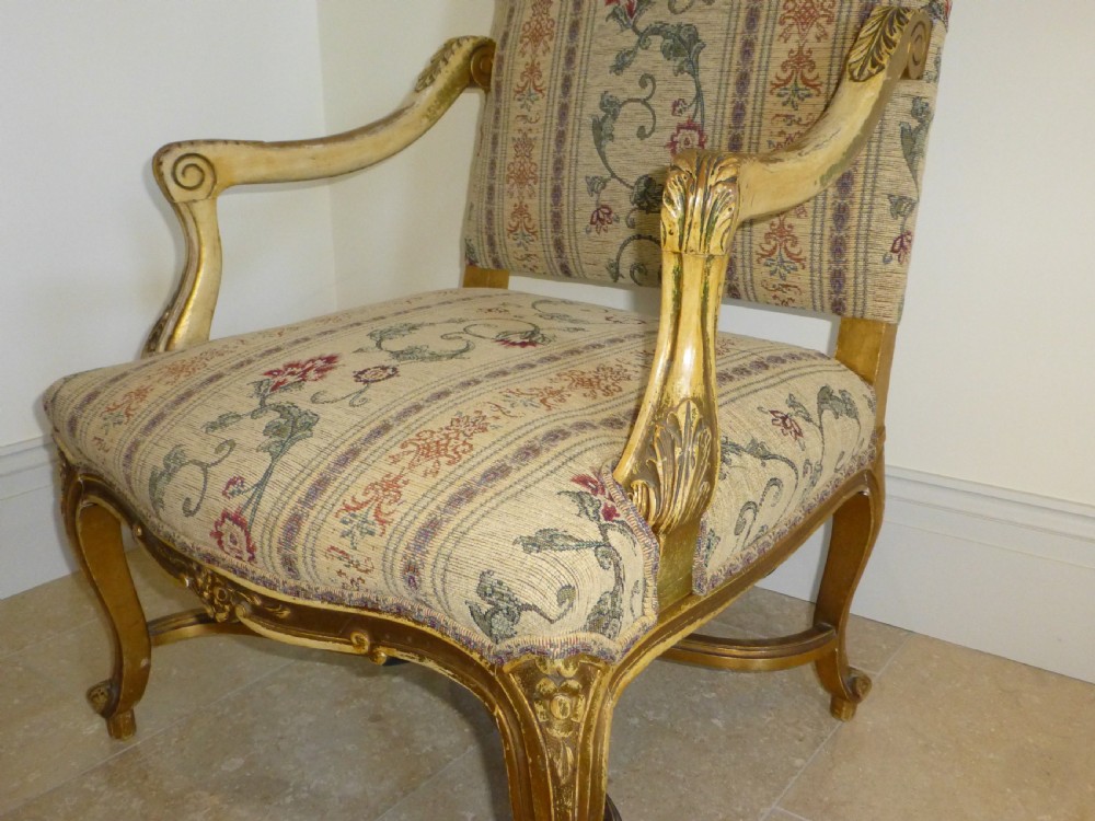 A pair of 19th-century giltwood Gainsborough salon armchairs with floral pattern upholstery and cabriole legs. View VIII
