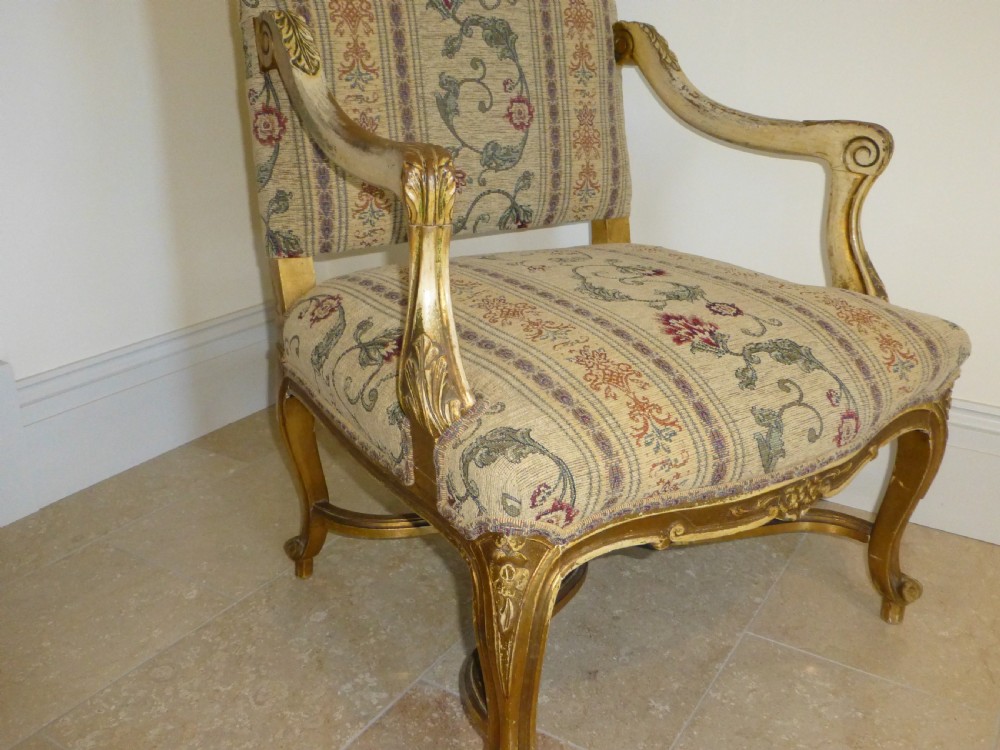 A pair of 19th-century giltwood Gainsborough salon armchairs with floral pattern upholstery and cabriole legs. View IX