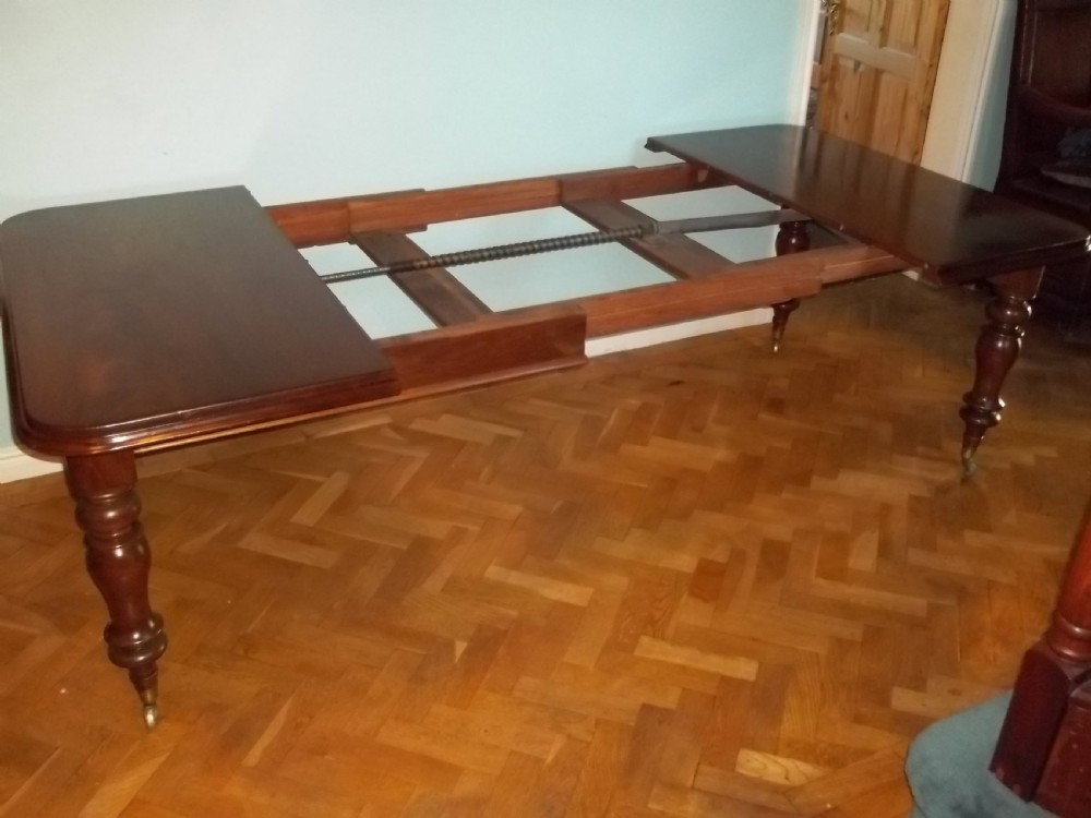 Lovely quality wind-out extending mahogany dining table with four leaves windout winding to seat 10 / 12  people View II