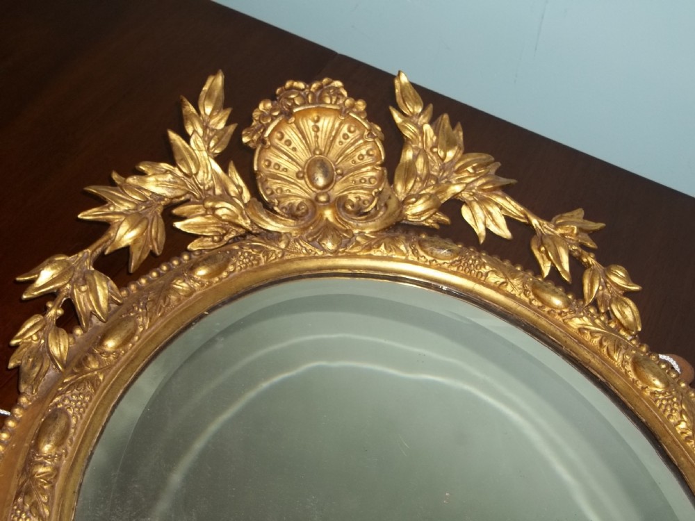 Pair of Regency water gilded oval gilt girandole mirrors View II