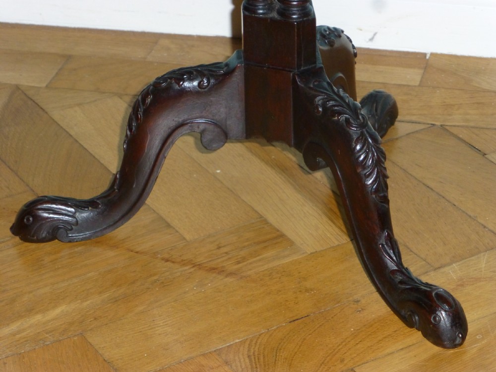 A dark brown Regency tripod side table featuring a carved rectangular pie crust top mounted on a turned pedestal shaft with three scrolled legs. View III