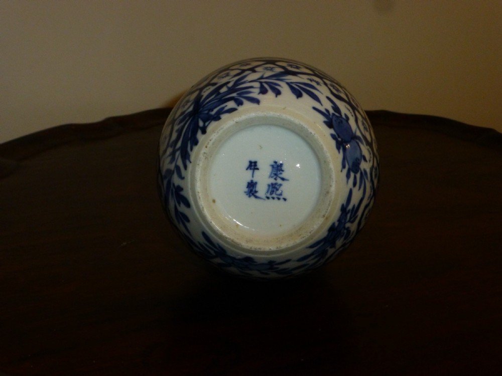 A Chinese blue and white porcelain double gourd vase decorated with figurative cartouches and floral diaper patterns. View IV
