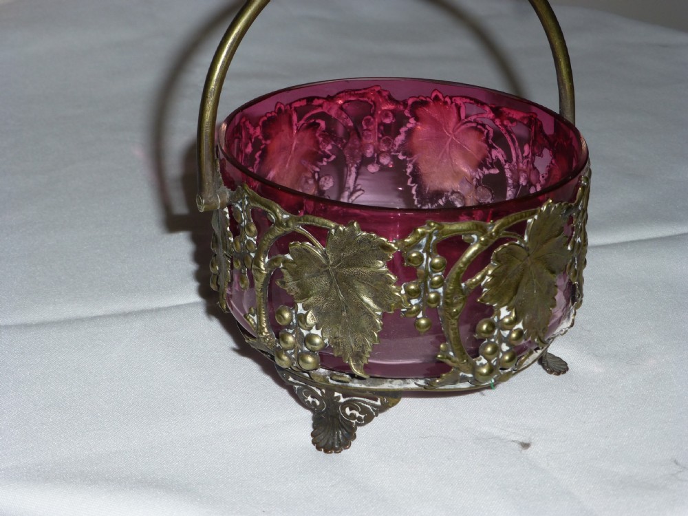 Victorian cranberry preserve dish with silver gilt basket.