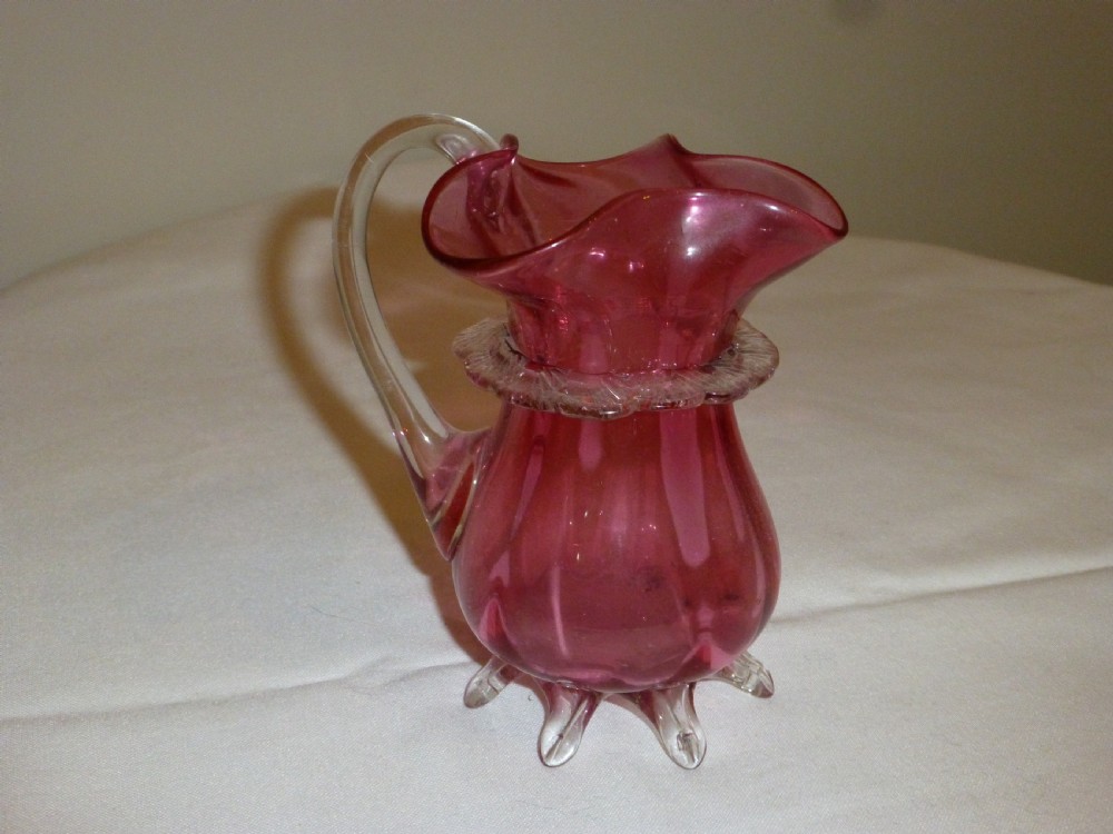 Rare design cranberry jug. Circa 1860