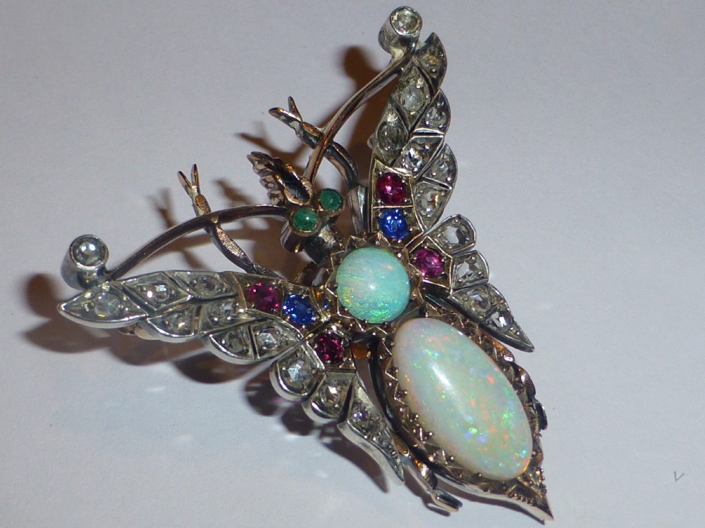 Victorian insect brooch set with an oval opal, a turquoise cabochon, sapphires, rubies, and rose-cut diamonds in silver-topped gold. View III