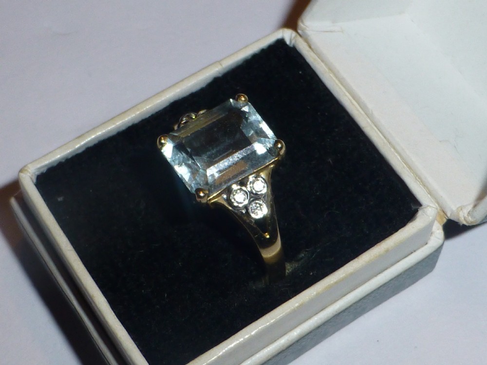 Aquamarine emerald cut diamond and gold ring